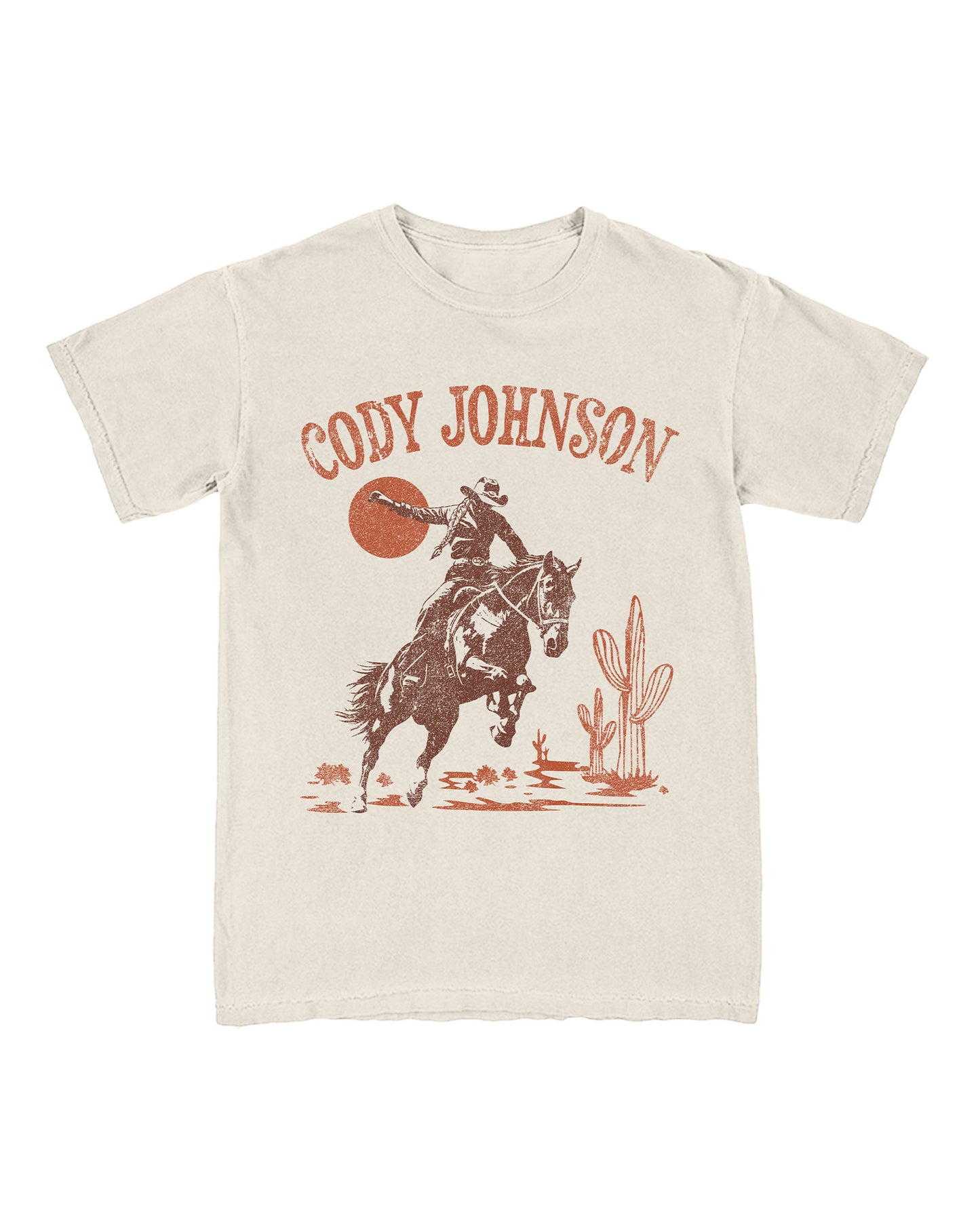 T-shirt with a graphic of a cowboy riding a horse and cactus, featuring the text 'Cody Johnson'.