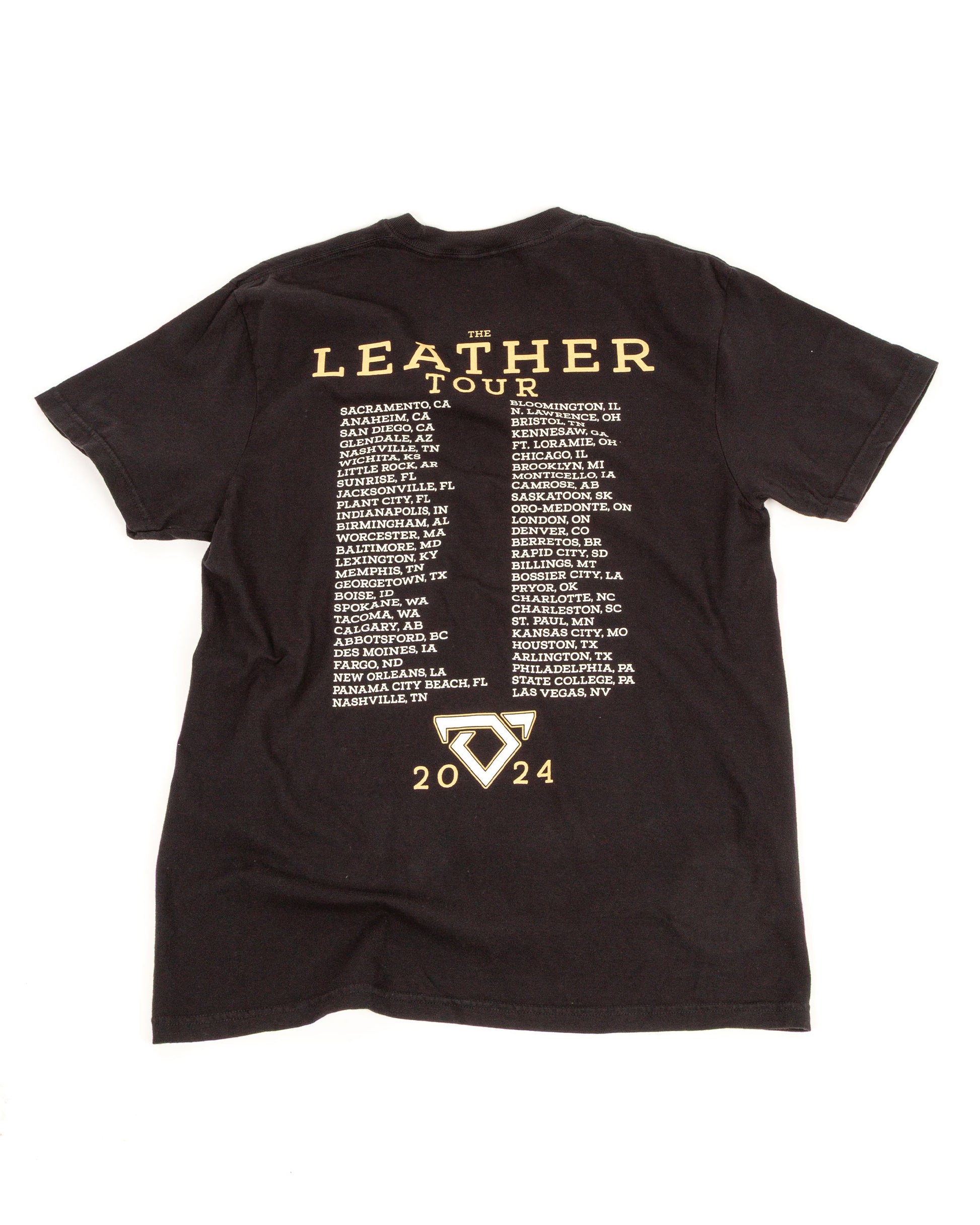 Black t-shirt with 'The Leather Tour' text and event dates on a white background