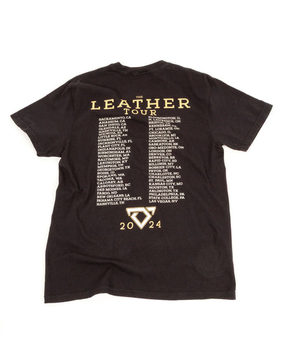 Black t-shirt with 'The Leather Tour' text and event dates on a white background