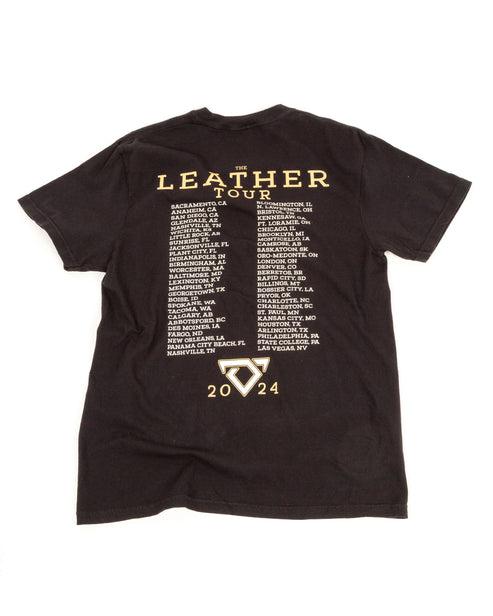 Black t-shirt with 'The Leather Tour' text and event dates on a white background