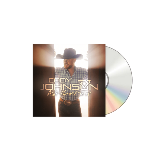 Vinyl record with a cover featuring a person wearing a cowboy hat and plaid shirt, with 'Cody Johnson' and album title on it.