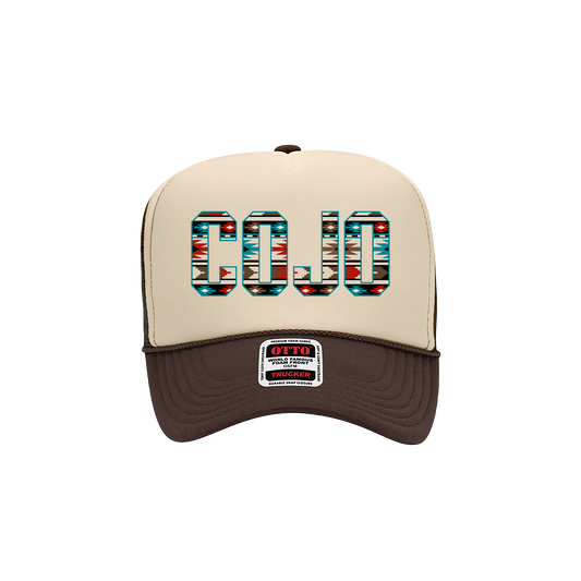 Beige and brown trucker hat with colorful 'COJO' text in aztec print on the front
