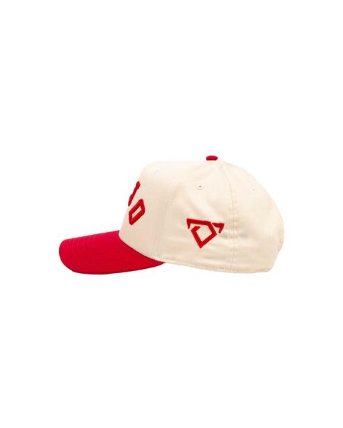 Cap with red and beige design on a white background