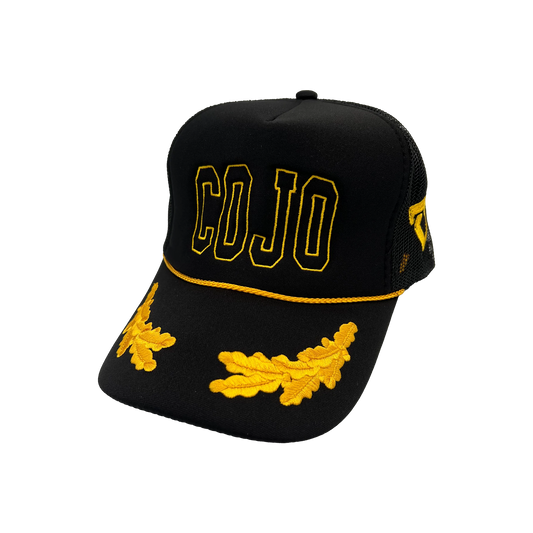 Black cap with yellow 'COJO' text and decorative elements on a white background Cody Johnson