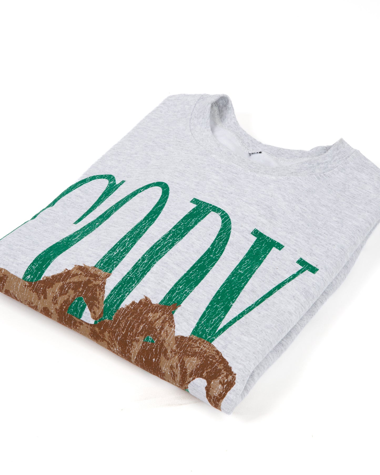 A folded light heather gray t-shirt featuring a green CODY text print