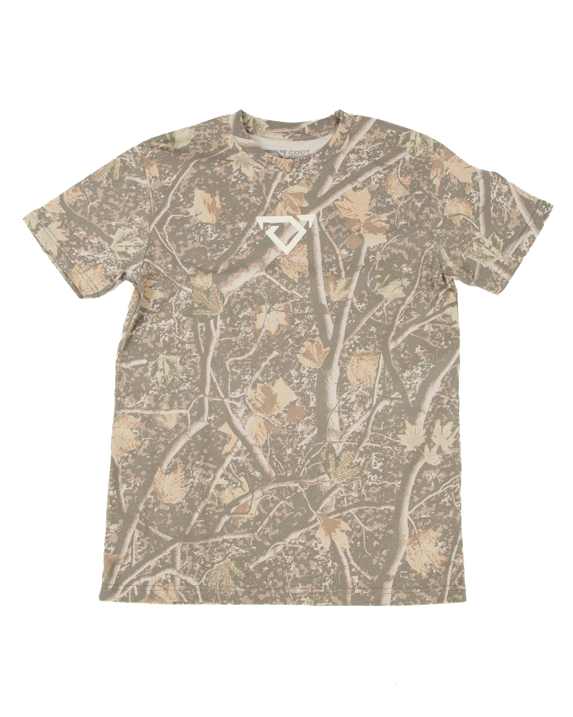 A short-sleeve crewneck t-shirt featuring an all-over camouflage pattern of branches and leaves in shades of brown, beige, and gray, with a small cream COJO bull logo on the center chest.