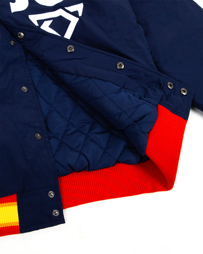 Close-up of a blue jacket with red and yellow accents on a white background