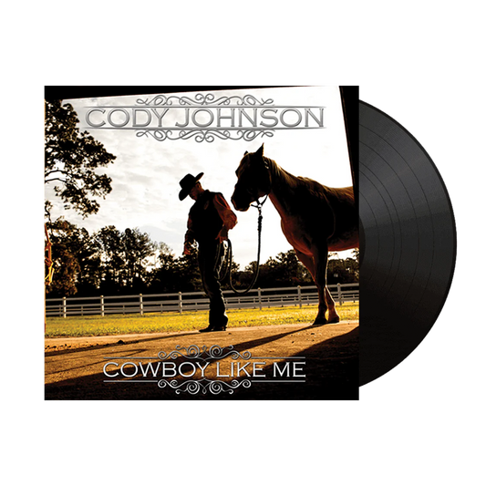Vinyl record with cover featuring a silhouette of a man and horse, labeled 'Cody Johnson: Cowboy Like Me'. COJO