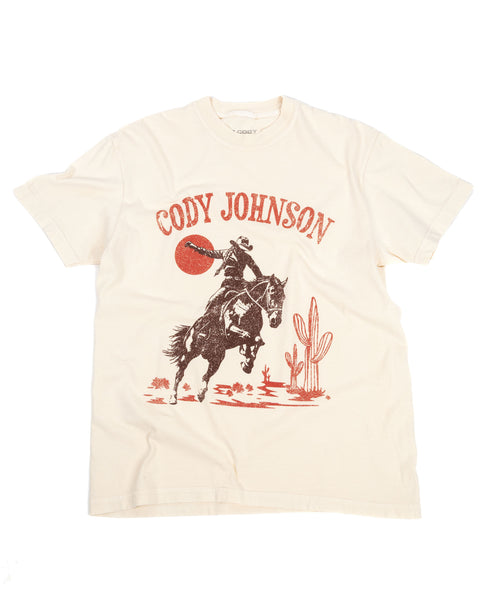 Beige t-shirt with a graphic of a horse and cactus, featuring the text 'Cody Johnson'.