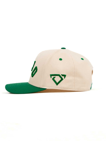 Beige and green cap with COJO bull logo on the side