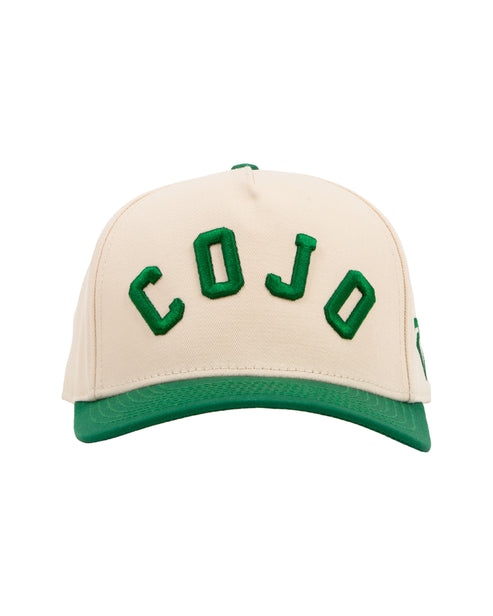 Beige cap with green accents and 'COJO' branding on a white background