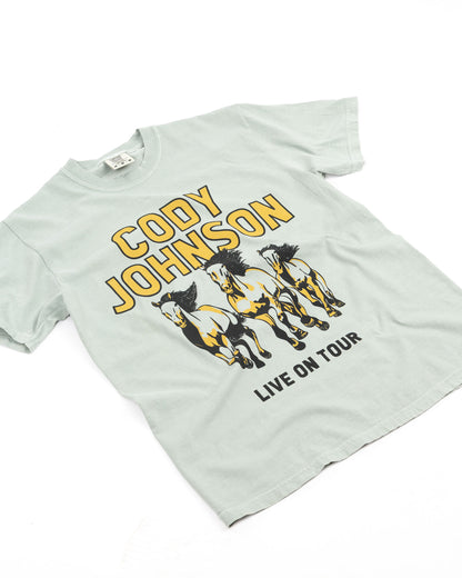 Light sage t-shirt with 'Cody Johnson Live on Tour' graphic and running horses