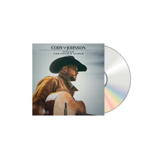 Vinyl album cover with a person wearing a cowboy hat and jacket, featuring the text 'Cody Johnson Human The Double Album'.