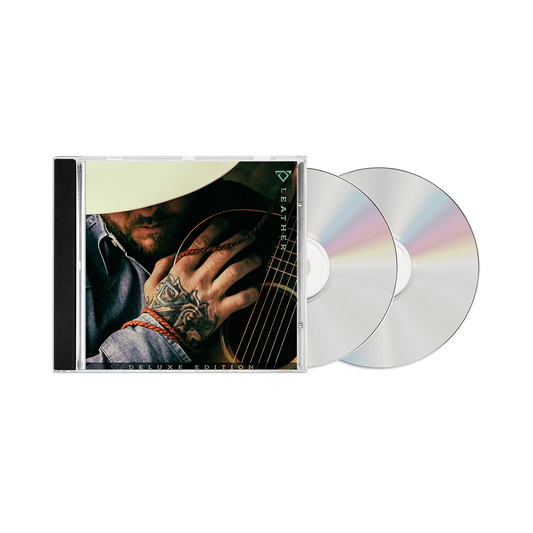 CD with a guitar-themed cover and two discs on a white background