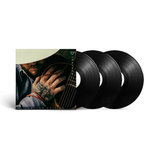 Vinyl records with a cover featuring a person holding a guitar on a black background Cody Johnson COJO
