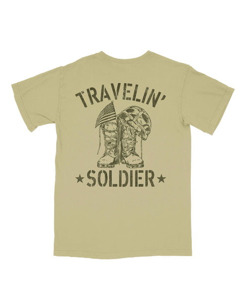 Beige t-shirt with 'Travelin' Soldier' graphic on a white background