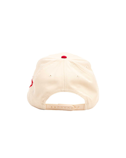 Beige cap with a red logo on a white background